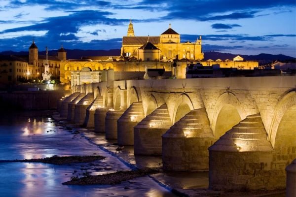 Visit the Roman Bridge of Cordoba. Travel to Andalusia.